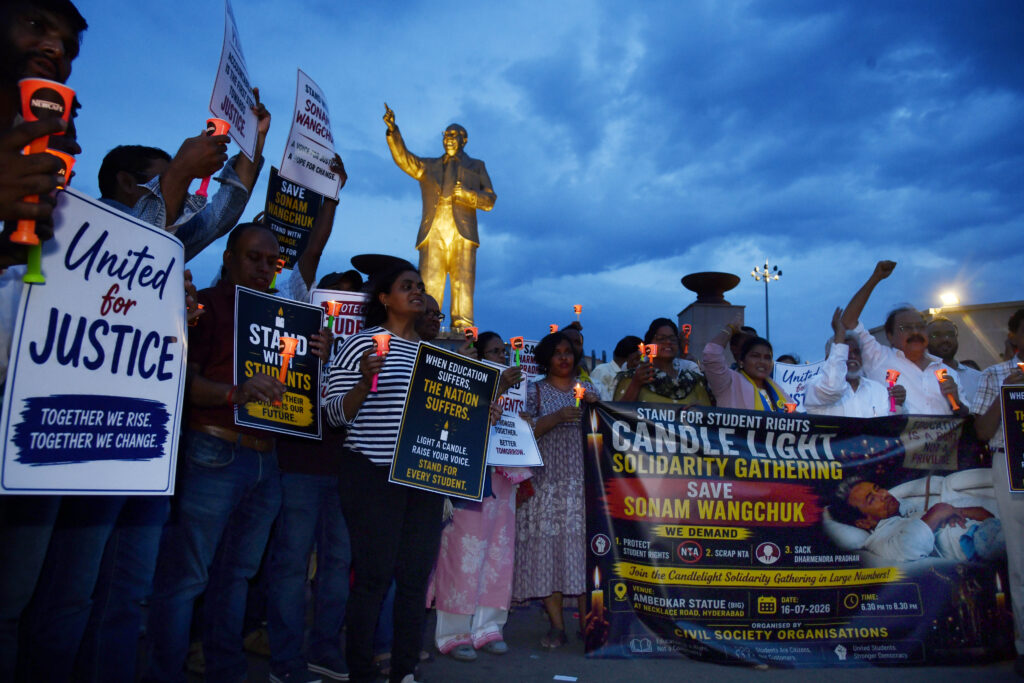 Students, youth activists and members of various civil society organisations participate in a candlelight solidarity gathering at Dr. B.R. Ambedkar Statue, Necklace Road, Hyderabad, on Thursday, expressing support for Sonam Wangchuk and demanding protection of student rights, scrapping of the National Testing Agency (NTA), and accountability over issues affecting students' education.